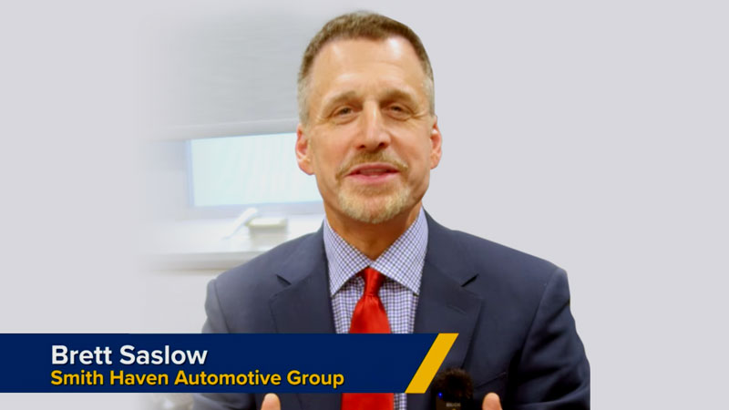 The start of the Armatus Dealer Uplift video about customer pay analysis and corrective measures regarding retail warranty reimbursement, which shows three people standing in front of a white board with graphs on it.