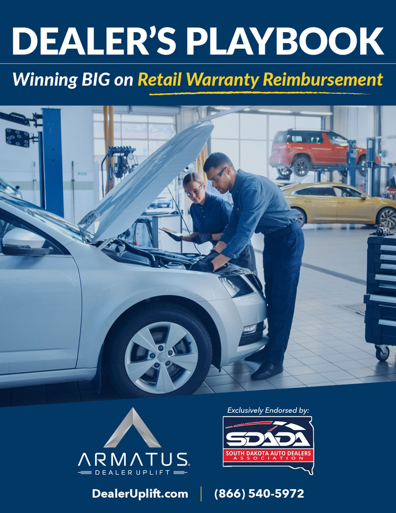 An image of two vehicle technicians performing warranty work on a vehicle at a new car dealership in South Dakota in relation to Armatus Dealer Uplist’s Dealer’s Playbook regarding Retail Warranty Reimbursement.